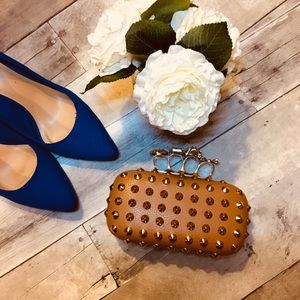Stunning tan studded knuckle clutch